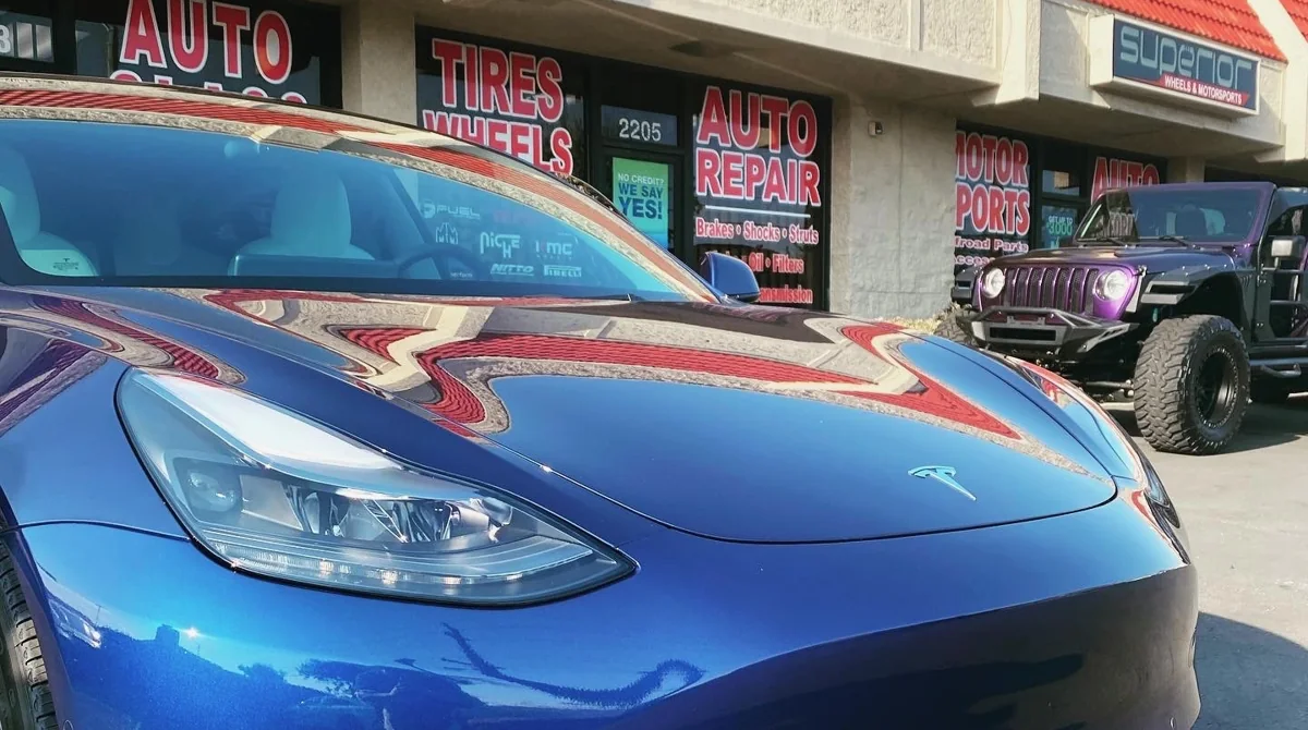 Blue Tesla outside Superior Auto Glass & Tint Shop in Ontario